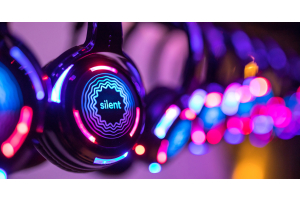 several pairs of headphones for a silent disco, illuminated by colorful LED lights