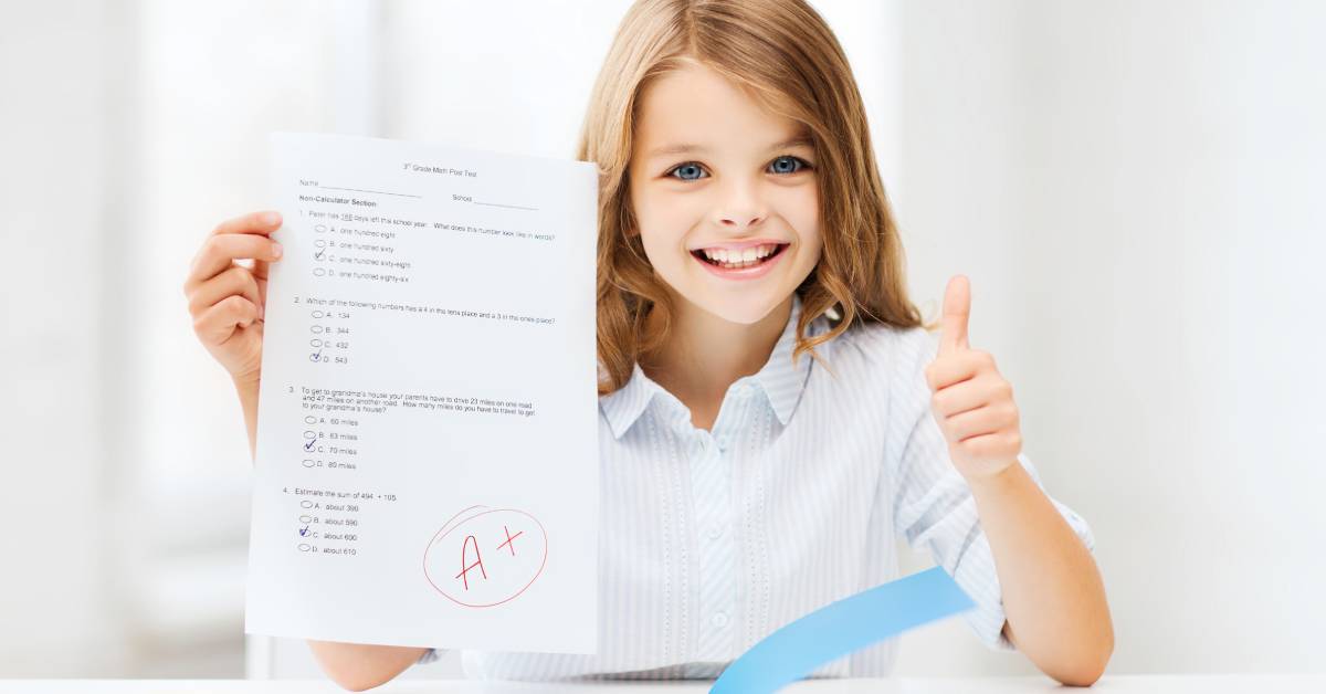 A girl holding a school multiple choice test with a thumbs up. On the test, there is an A+ circled in red ink.